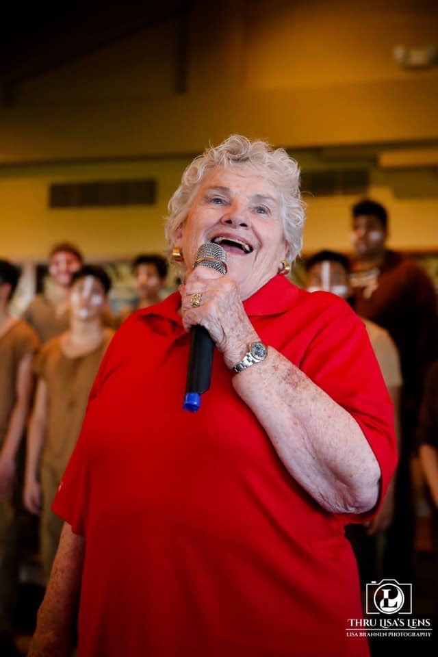 Shirley Casper speaking at a beneficiary event